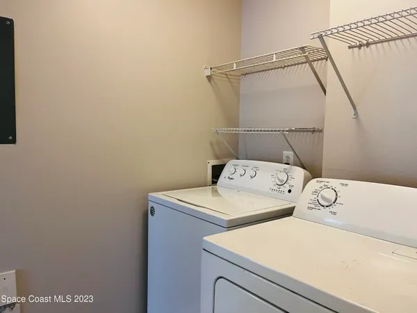 a utility room with dryer and washer