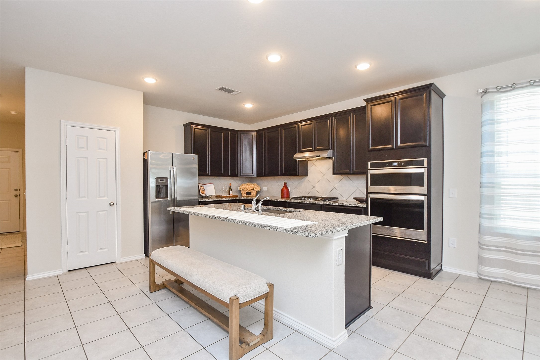 25918 Rustical Road Katy, TX 77493 - Photo 11 of 26 a kitchen with stainless steel appliances granite countertop a refrigerator sink and cabinets