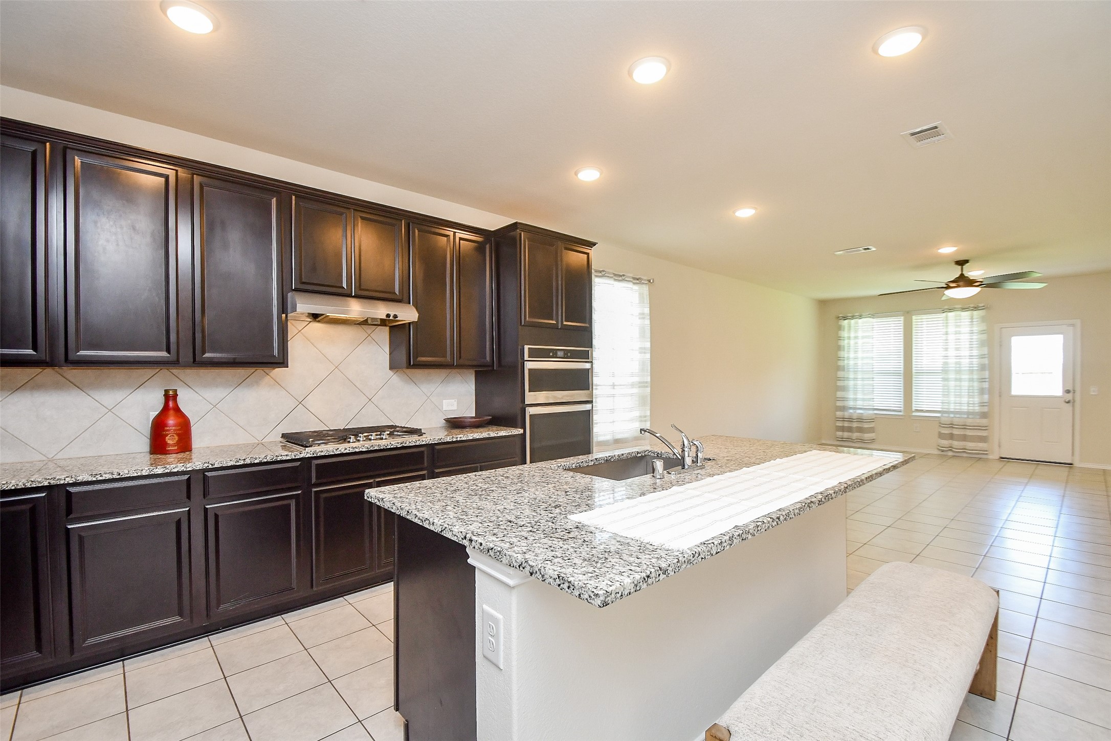 25918 Rustical Road Katy, TX 77493 - Photo 13 of 26 a kitchen with stainless steel appliances granite countertop a sink and cabinets