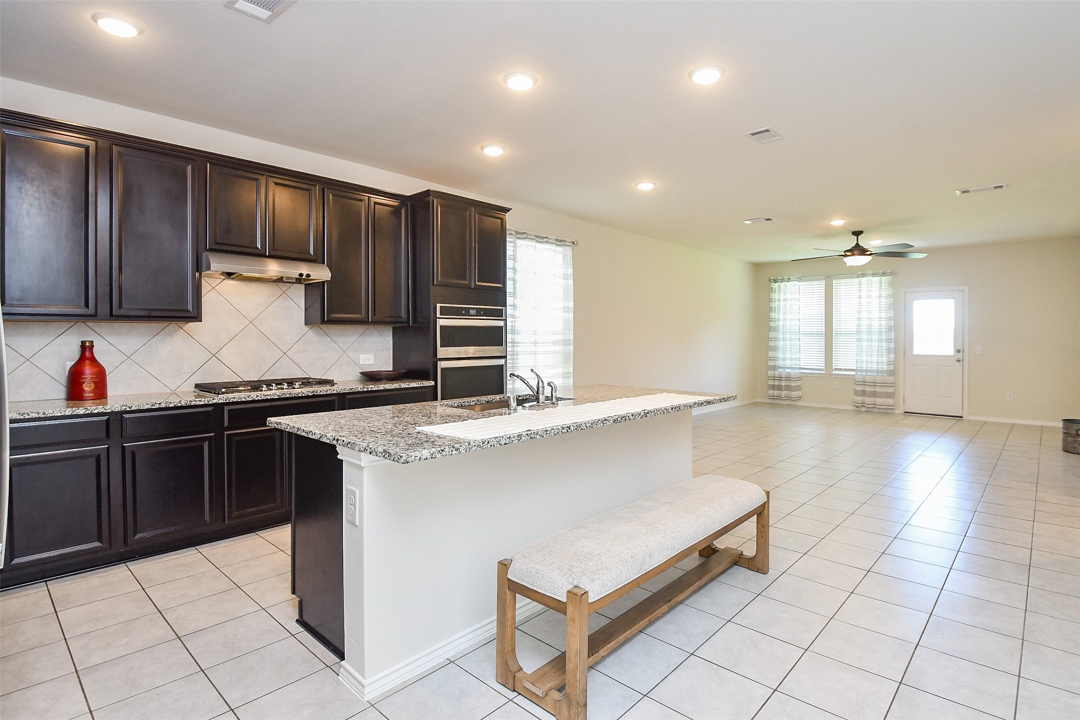 25918 Rustical Road Katy, TX 77493 - Photo 26 of 26 a kitchen with stainless steel appliances granite countertop a sink and cabinets