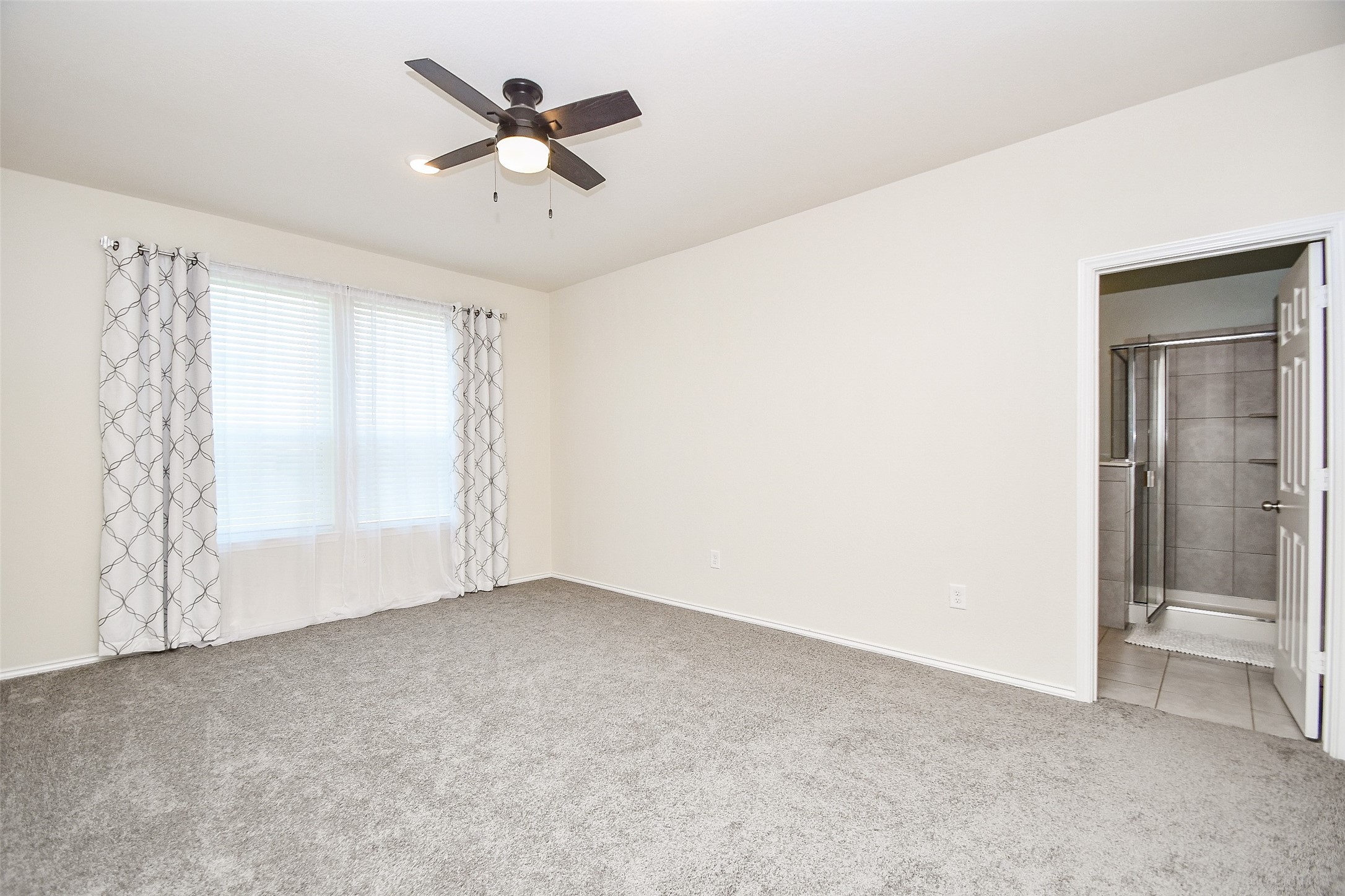 25918 Rustical Road Katy, TX 77493 - Photo 18 of 26 a view of an empty room with a window