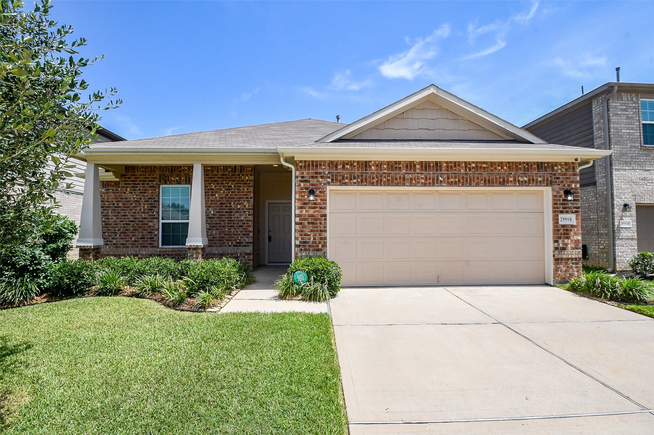 25918 Rustical Road Katy, TX 77493 - Photo 2 of 26 a front view of a house with garden