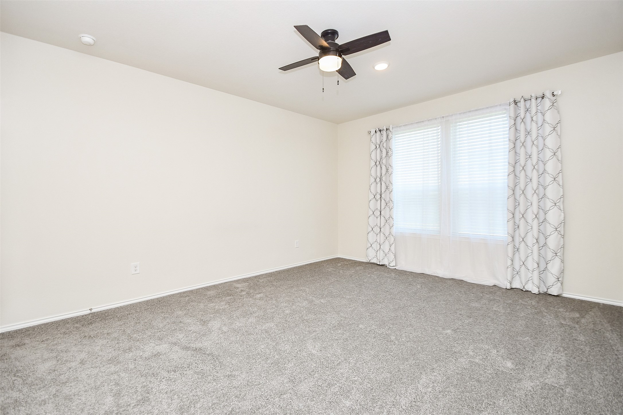 25918 Rustical Road Katy, TX 77493 - Photo 19 of 26 a view of a big room with carpet