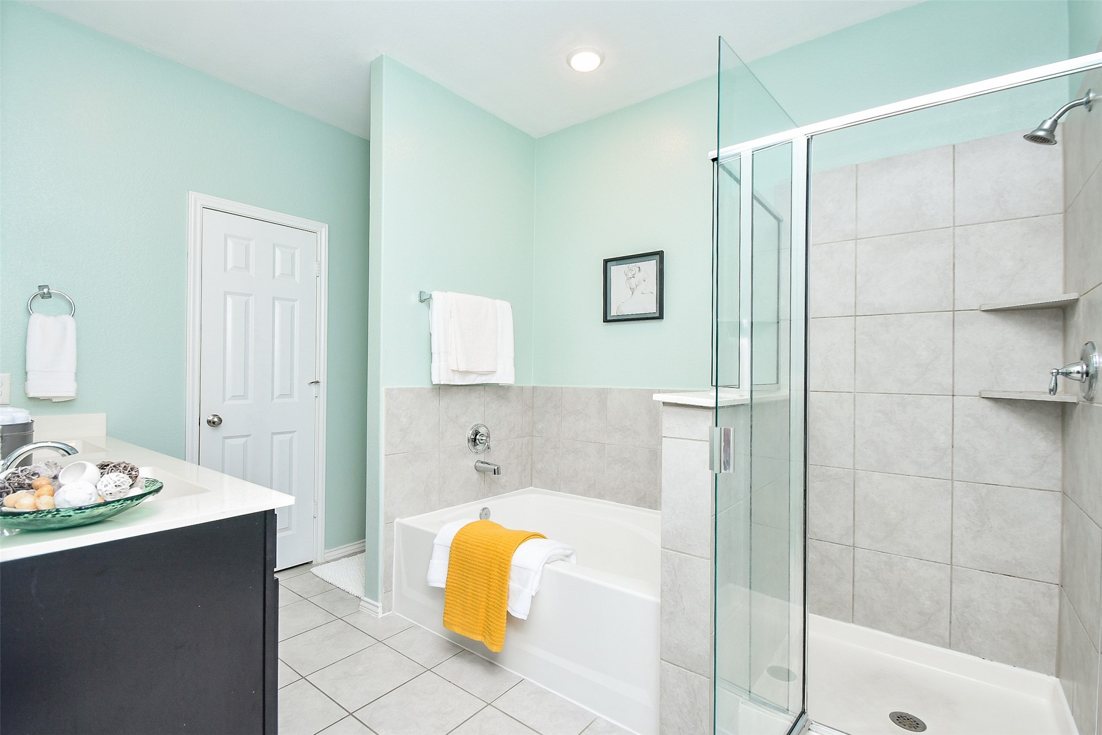 25918 Rustical Road Katy, TX 77493 - Photo 20 of 26 a bathroom with a tub shower and a sink