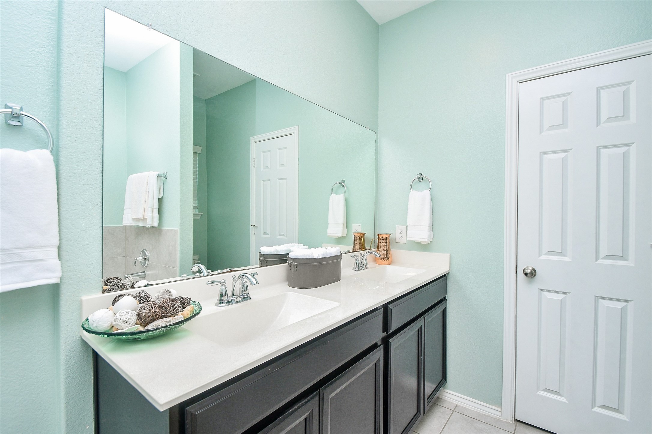 25918 Rustical Road Katy, TX 77493 - Photo 22 of 26 a bathroom with a sink and a mirror