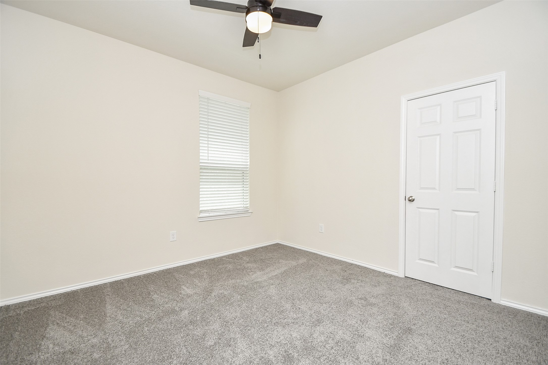 25918 Rustical Road Katy, TX 77493 - Photo 7 of 26 an empty room with a chandelier fan