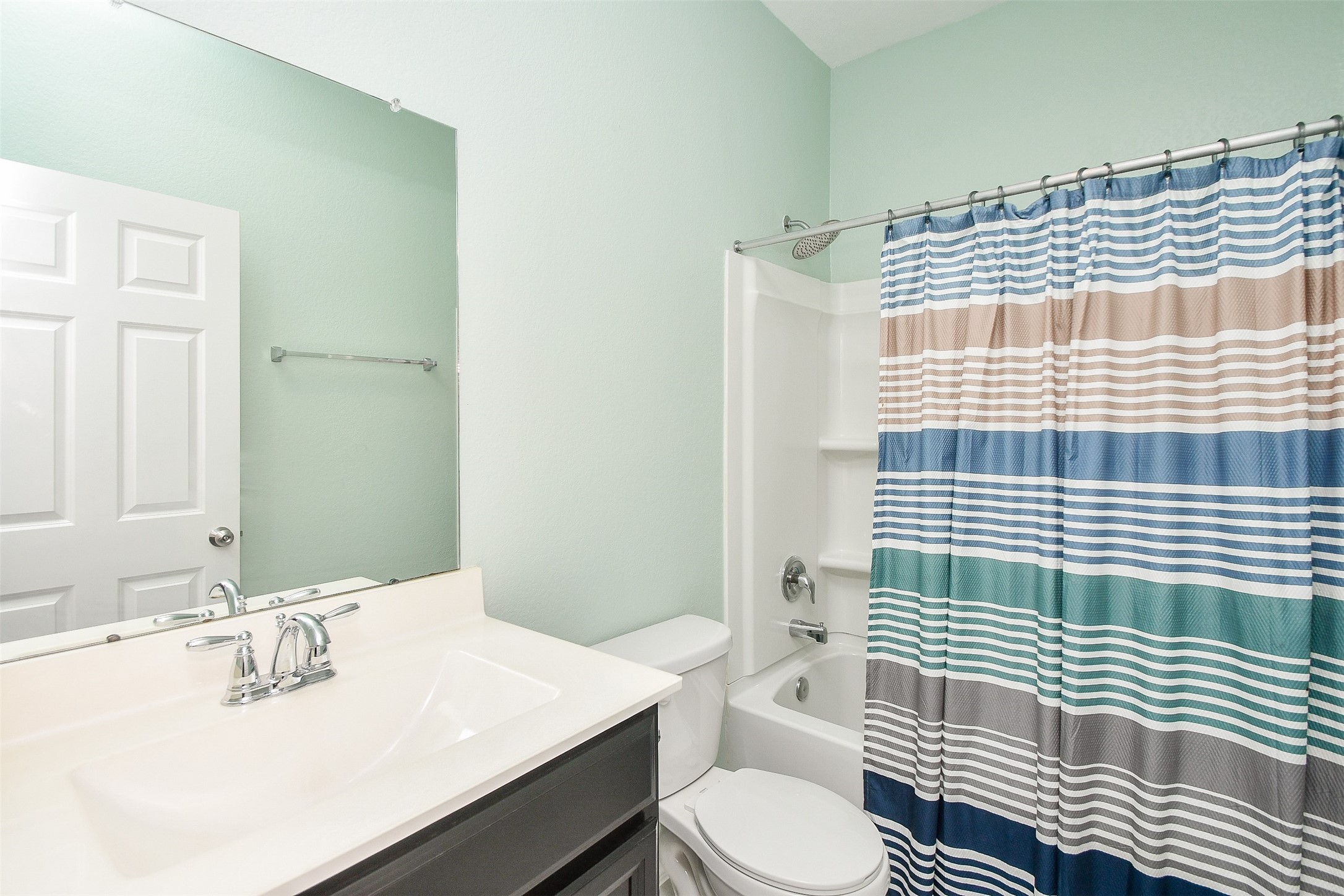 25918 Rustical Road Katy, TX 77493 - Photo 8 of 26 a bathroom with a sink toilet and shower