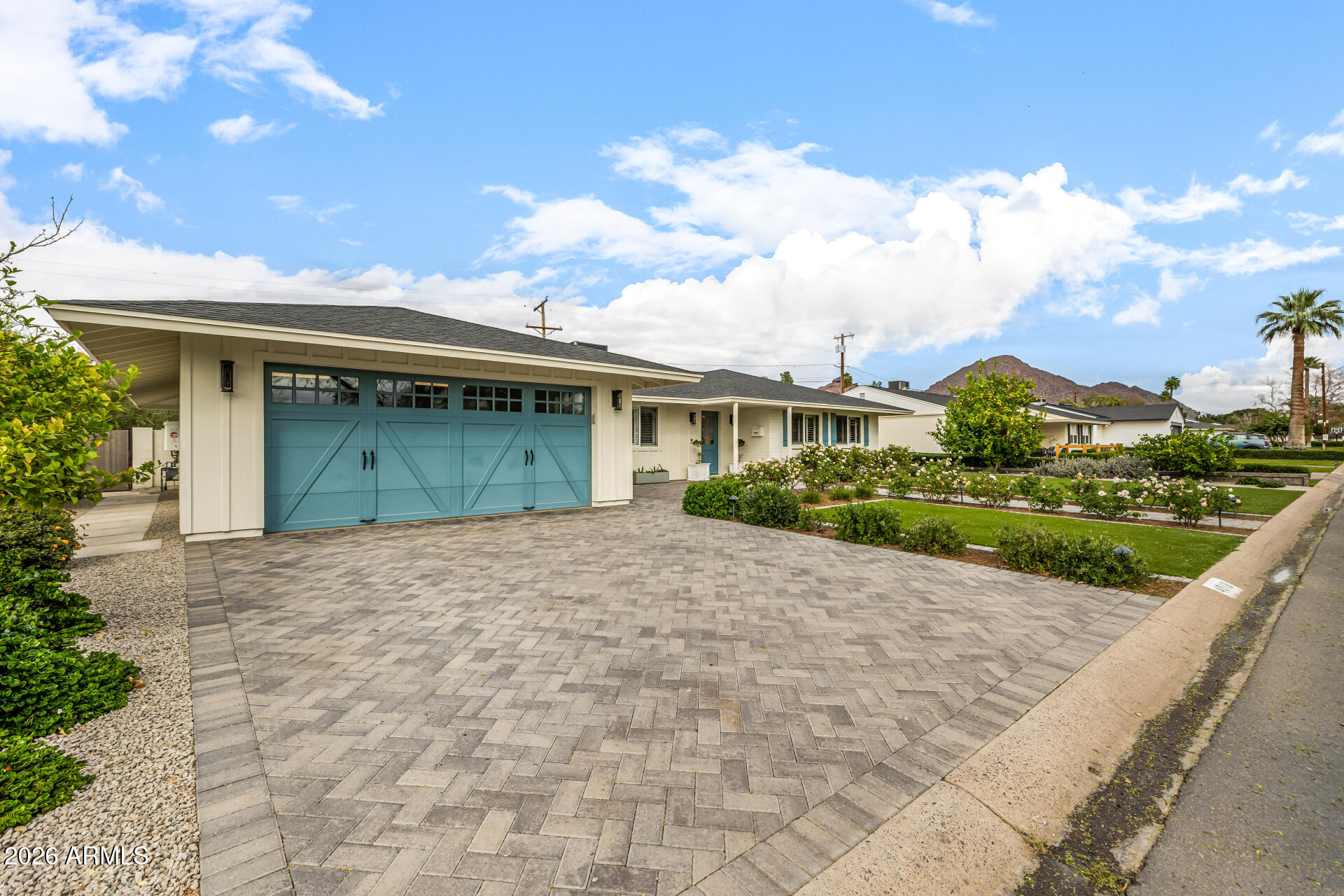 4010 East Coolidge Street Phoenix, AZ 85018 - Photo 11 of 82 a front view of a house with a garden and plants
