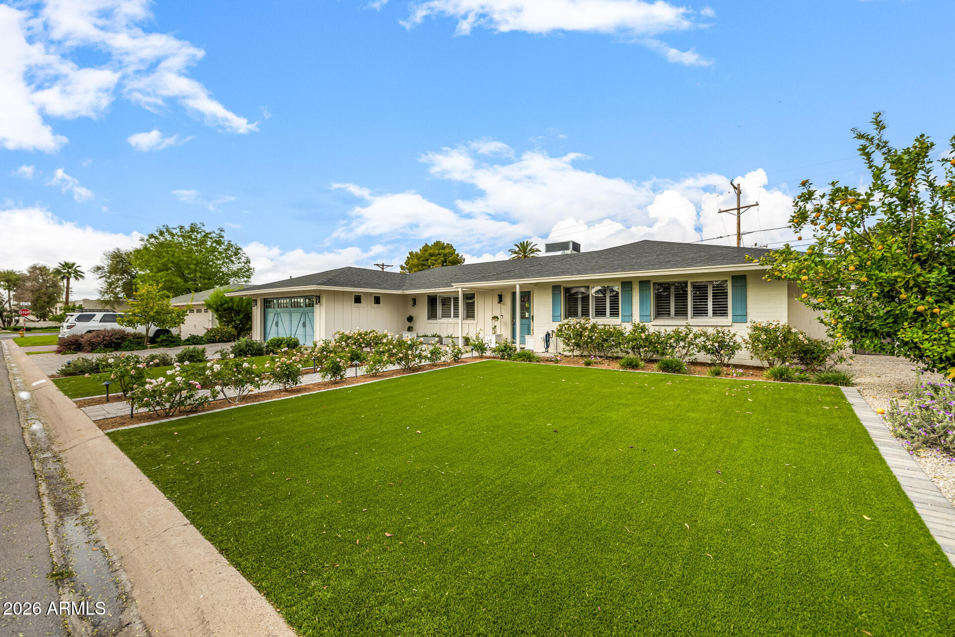 4010 East Coolidge Street Phoenix, AZ 85018 - Photo 13 of 82 a front view of a house with a garden