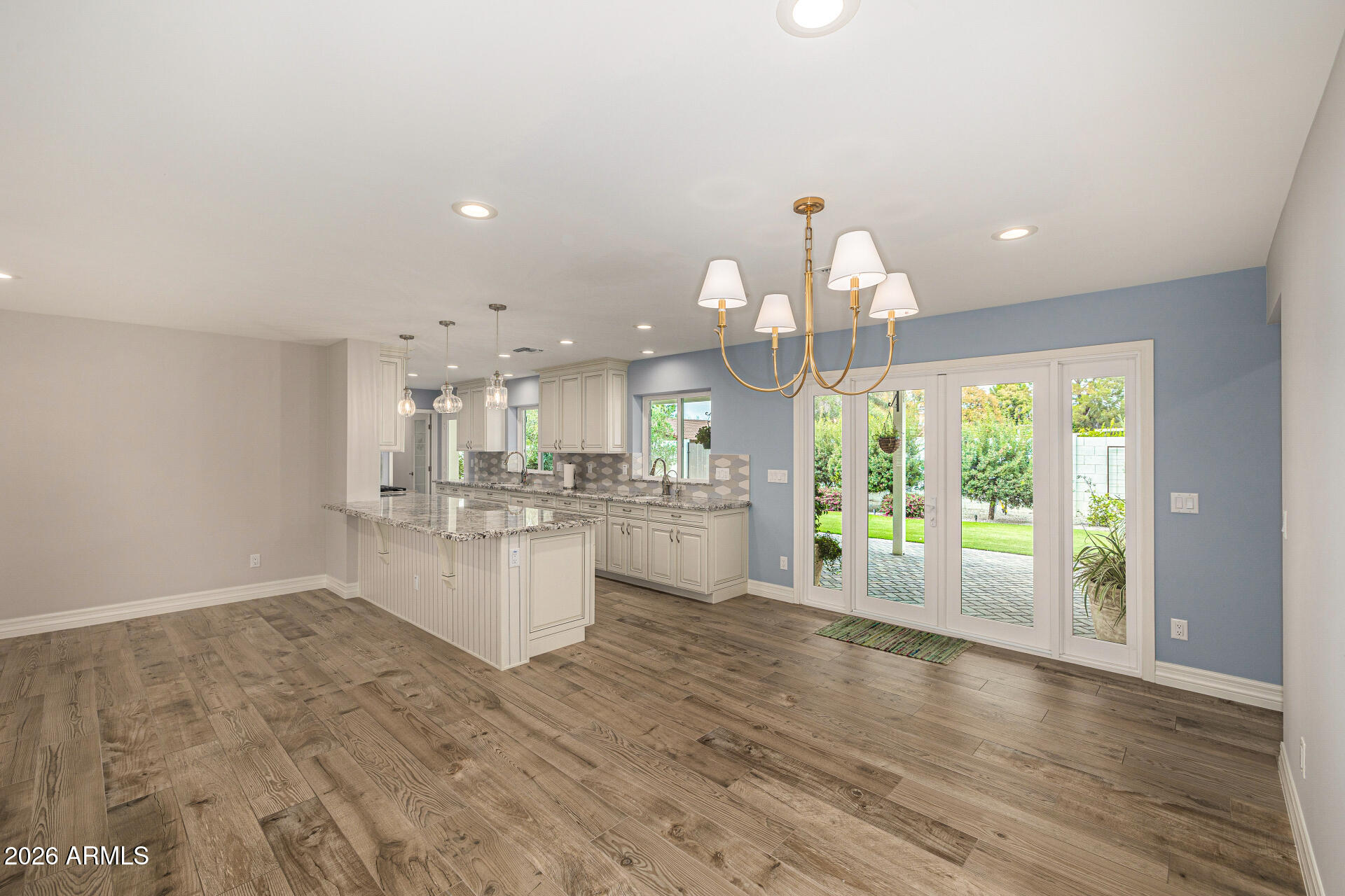 4010 East Coolidge Street Phoenix, AZ 85018 - Photo 24 of 82 a kitchen with a sink cabinets and wooden floor
