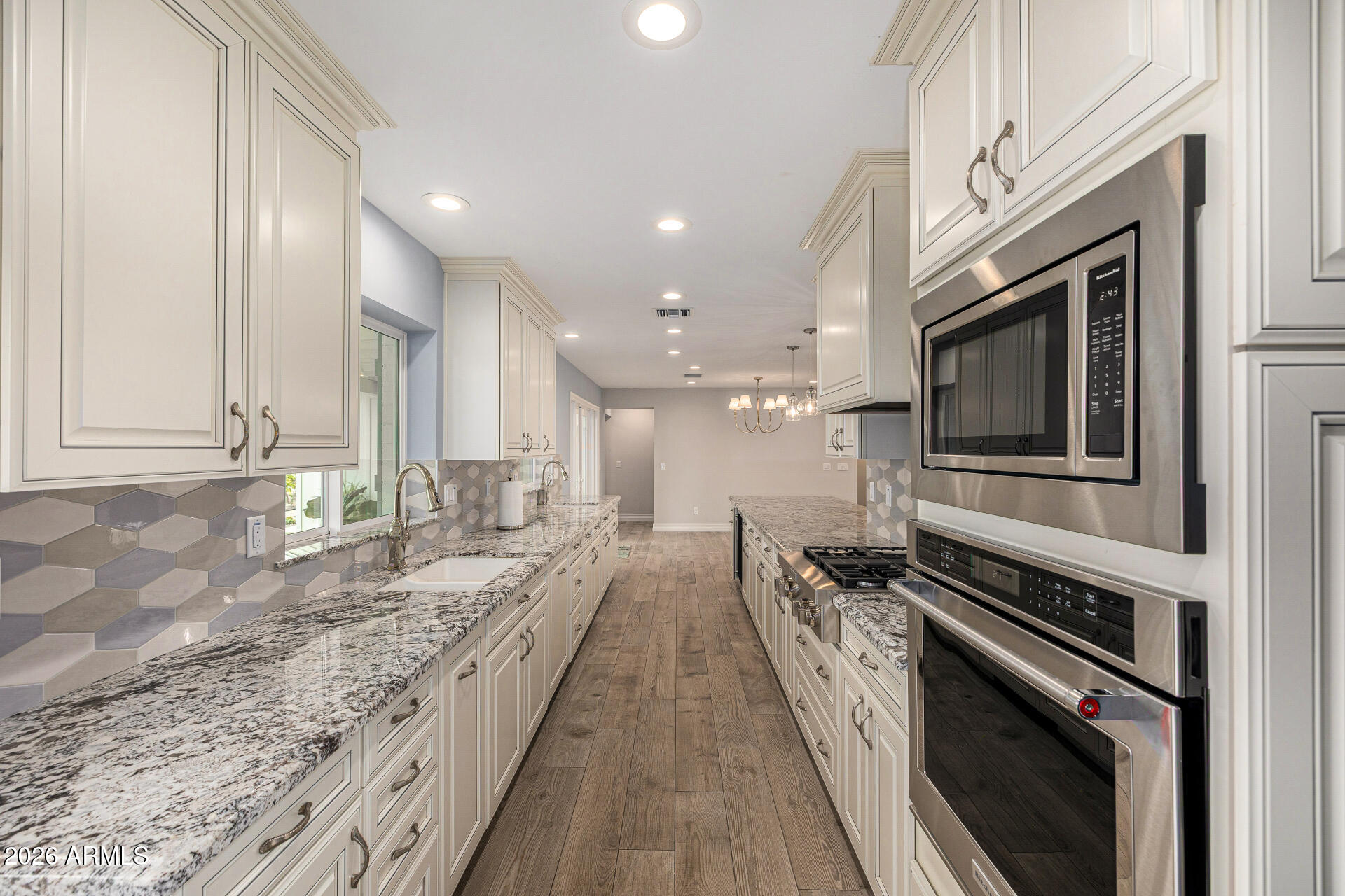4010 East Coolidge Street Phoenix, AZ 85018 - Photo 26 of 82 a view of a kitchen with stainless steel appliances granite countertop a stove and a sink