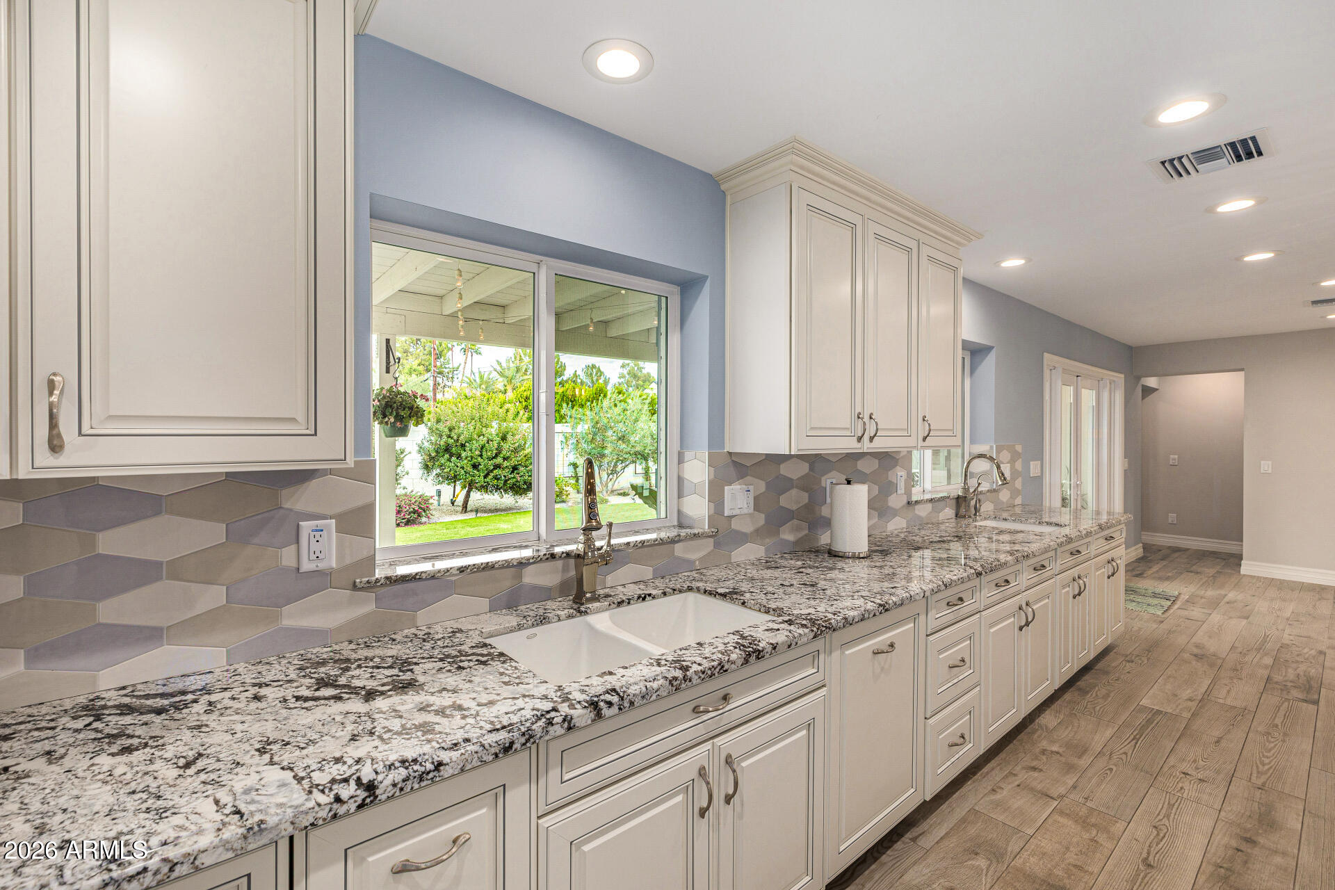 4010 East Coolidge Street Phoenix, AZ 85018 - Photo 28 of 82 a bathroom with a granite countertop sink and a window