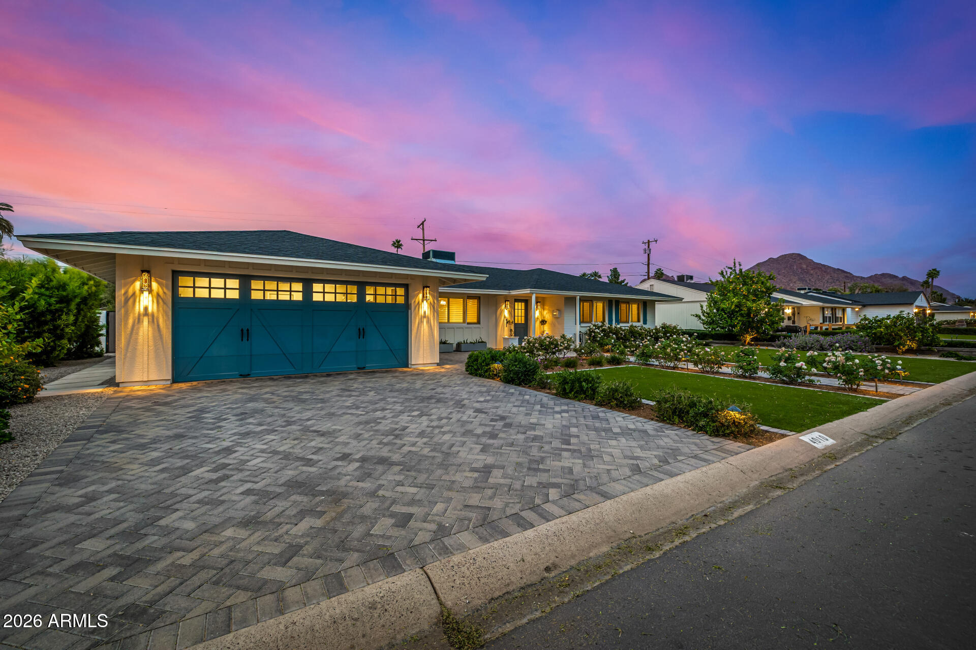 4010 East Coolidge Street Phoenix, AZ 85018 - Photo 3 of 82 a front view of a house with a yard and garage