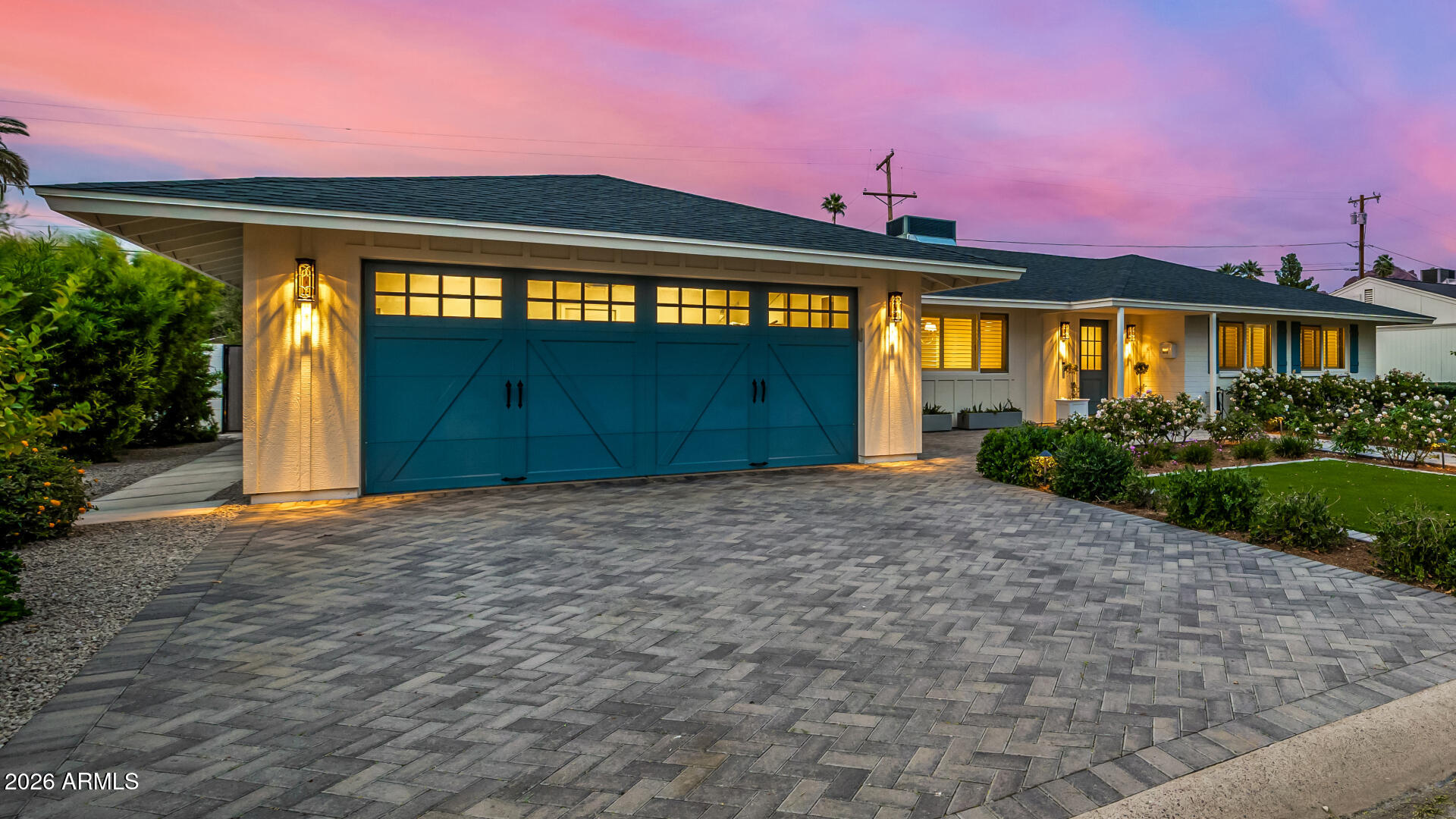 4010 East Coolidge Street Phoenix, AZ 85018 - Photo 4 of 82 a front view of a house with a yard and garage