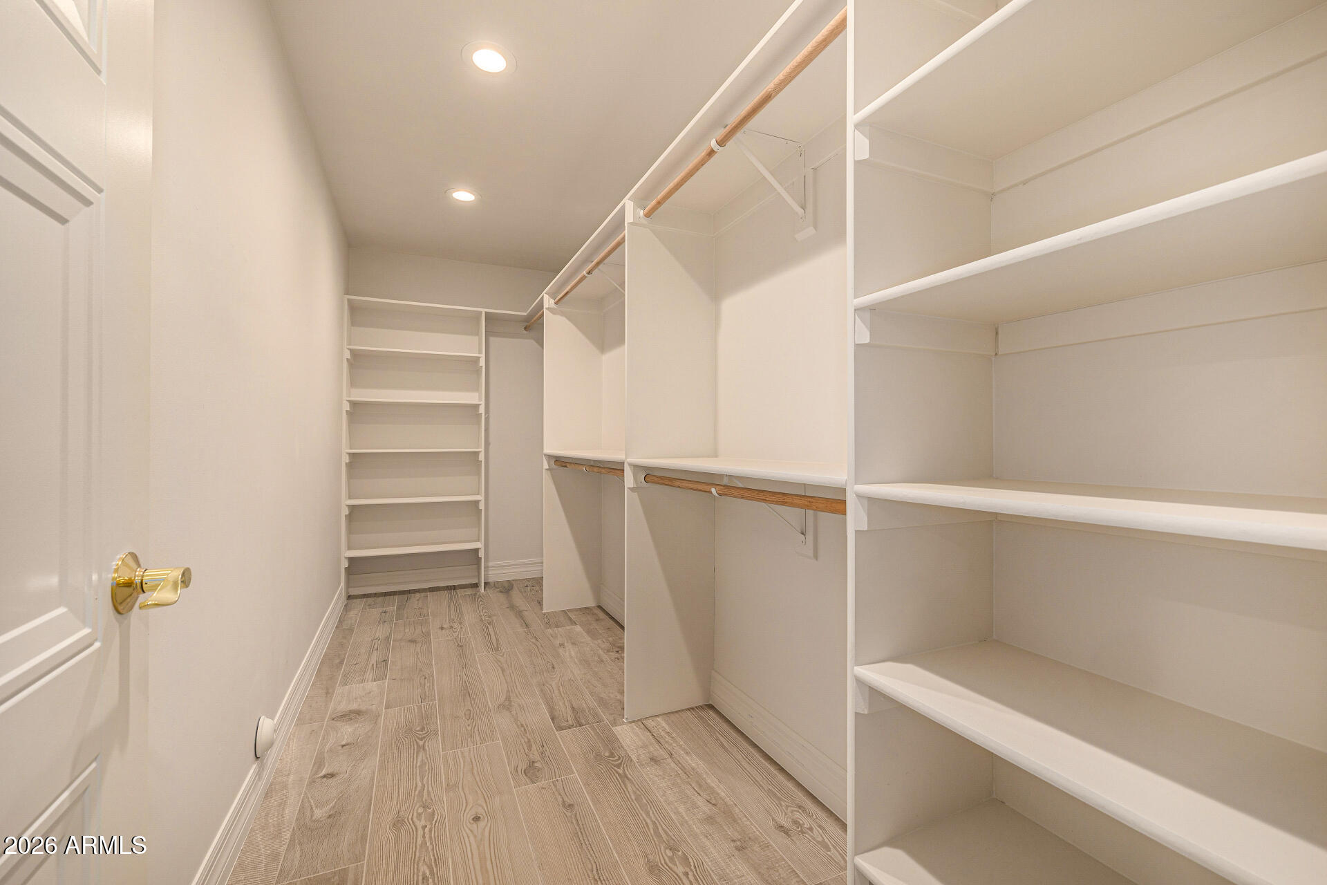 4010 East Coolidge Street Phoenix, AZ 85018 - Photo 44 of 82 a view of walk in closet with empty racks