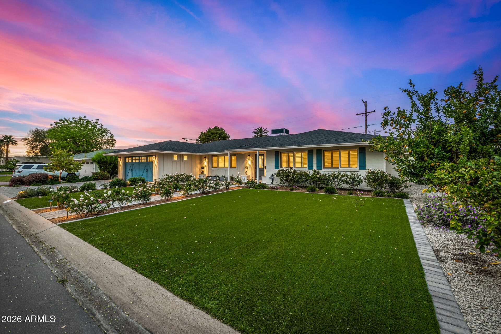 4010 East Coolidge Street Phoenix, AZ 85018 - Photo 5 of 82 a view of a house with a yard and potted plants