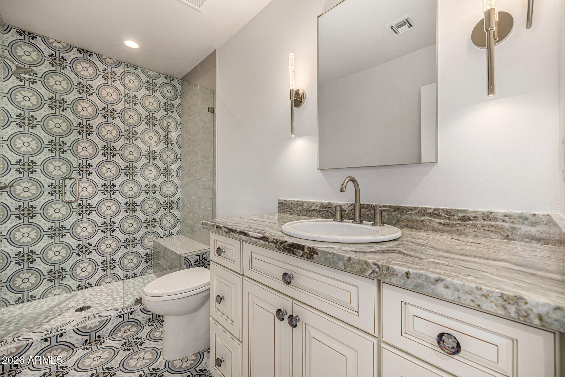 4010 East Coolidge Street Phoenix, AZ 85018 - Photo 52 of 82 a bathroom with a granite countertop sink a toilet and a mirror