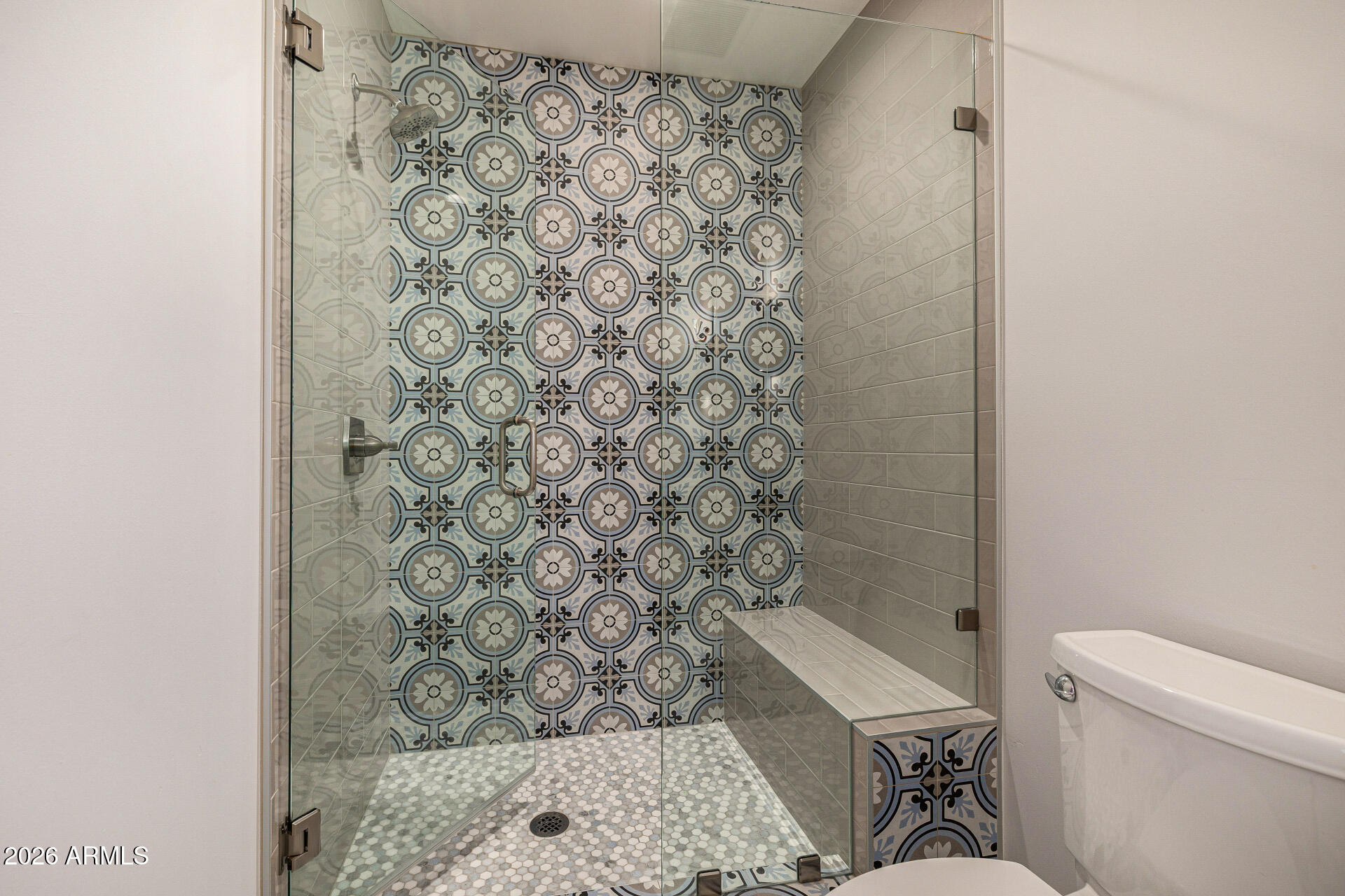 4010 East Coolidge Street Phoenix, AZ 85018 - Photo 53 of 82 a bathroom with a toilet and a shower curtain