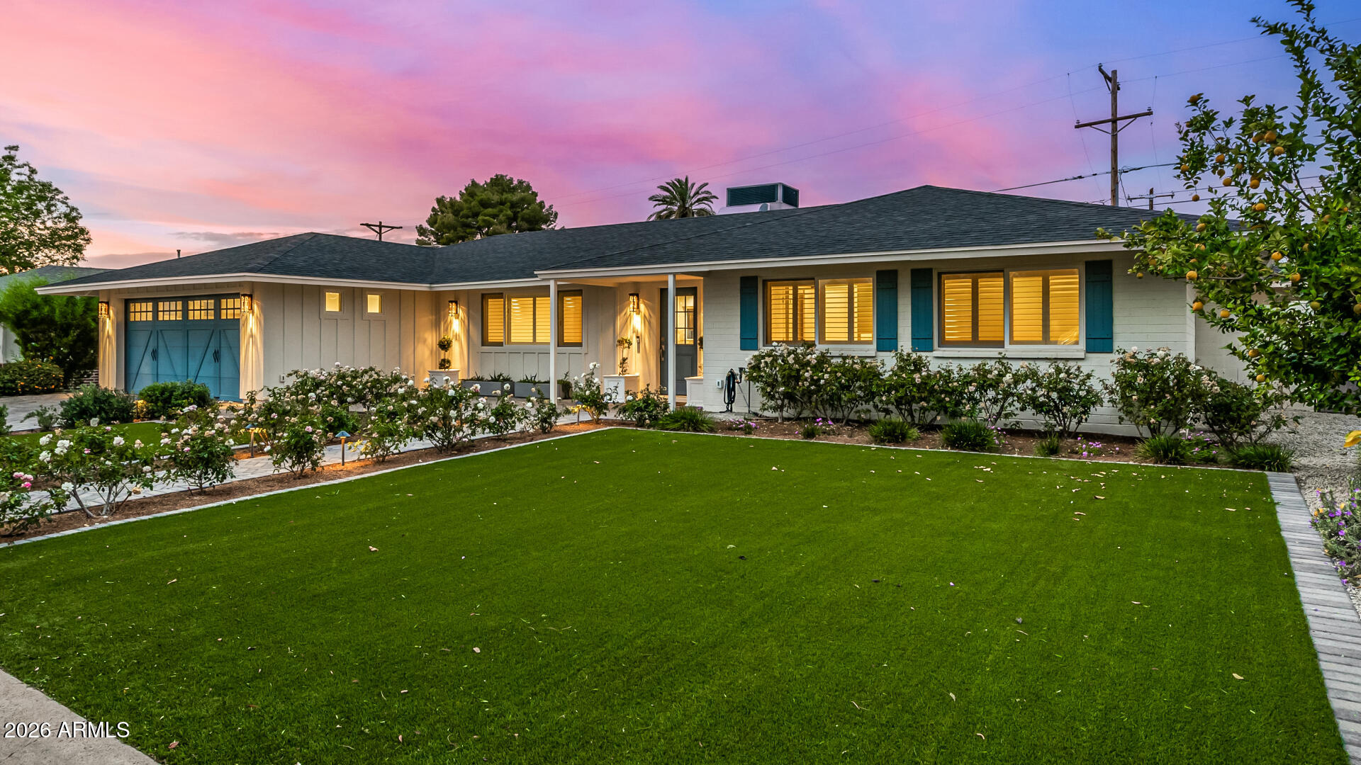 4010 East Coolidge Street Phoenix, AZ 85018 - Photo 6 of 82 a front view of a house with a garden