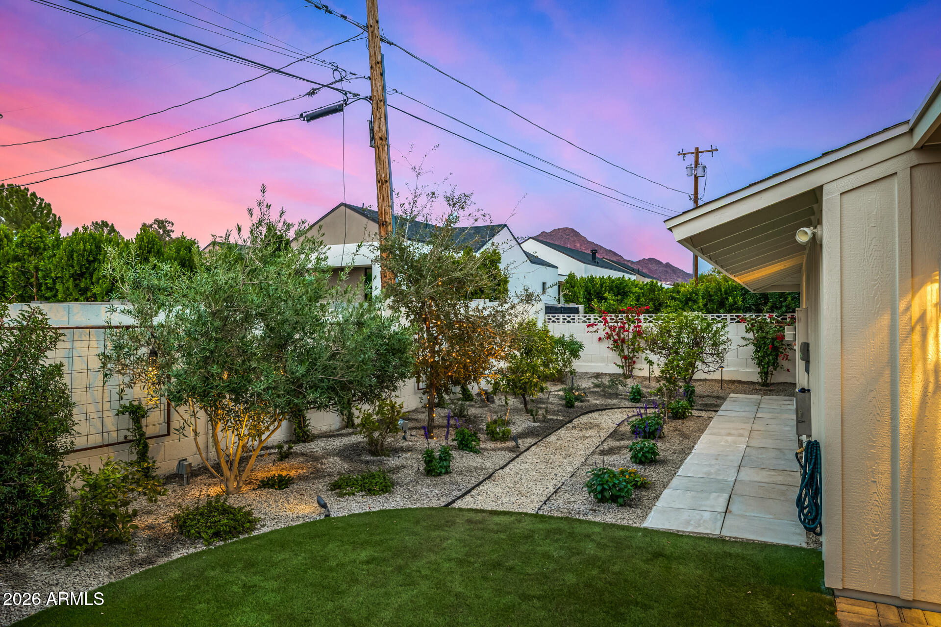 4010 East Coolidge Street Phoenix, AZ 85018 - Photo 61 of 82 a view of a patio with table and chairs and potted plants