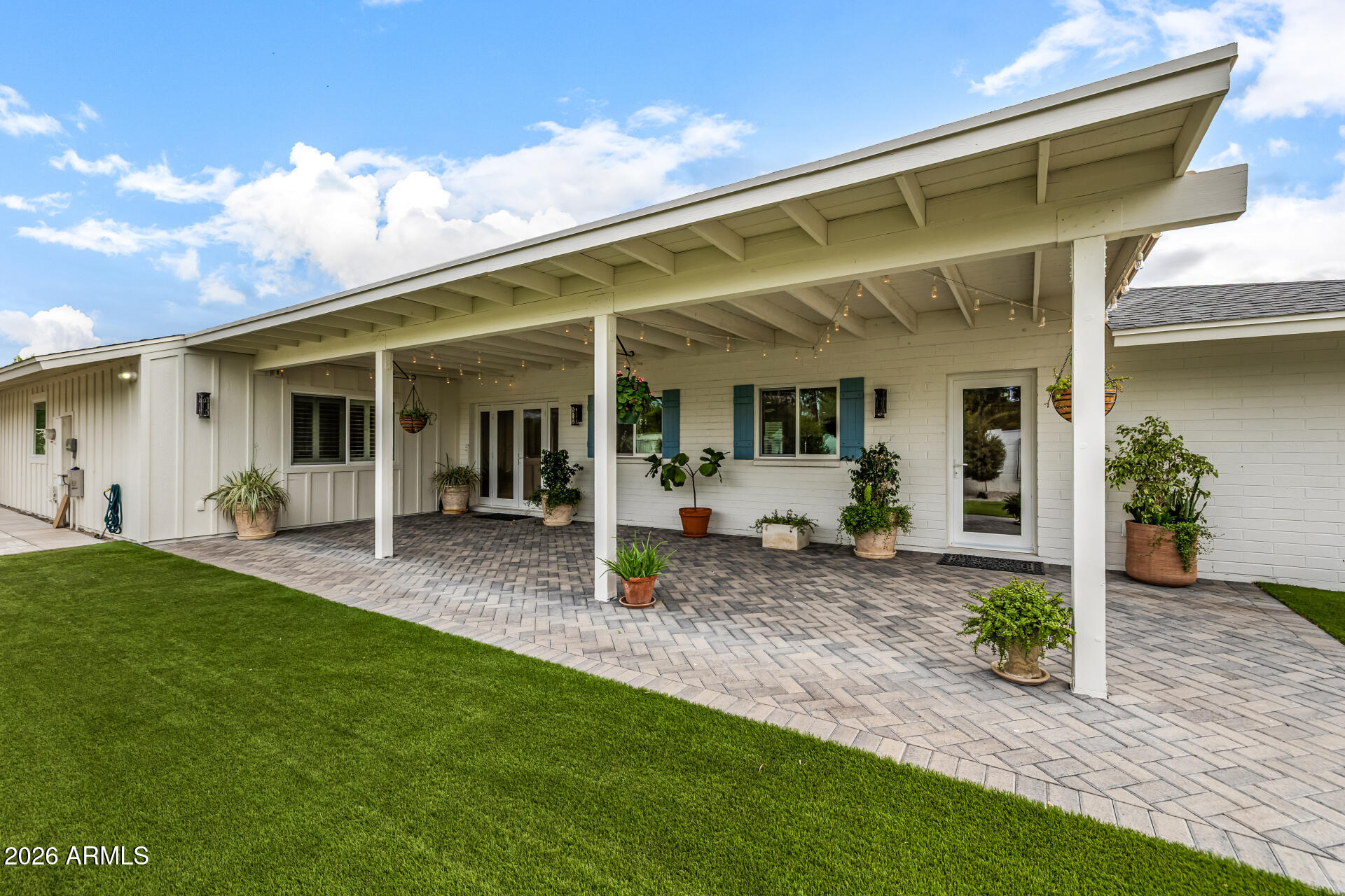 4010 East Coolidge Street Phoenix, AZ 85018 - Photo 69 of 82 a view of a house with backyard sitting area and porch