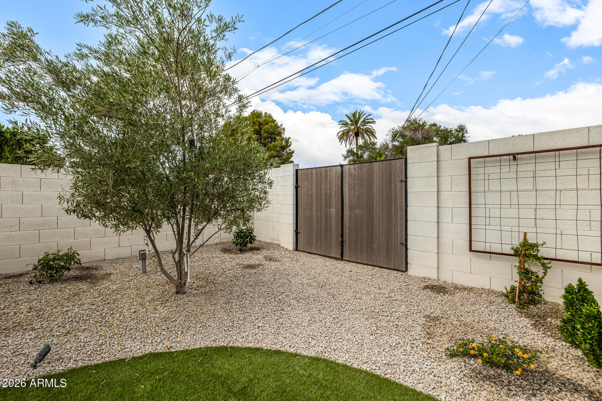 4010 East Coolidge Street Phoenix, AZ 85018 - Photo 71 of 82 a backyard of a house with table and chairs