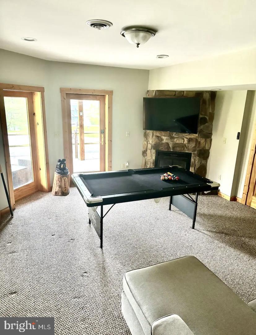 229 Rock Lodge Road McHenry, MD 21541 - Photo 7 of 16 Cozy game room with outdoor access.