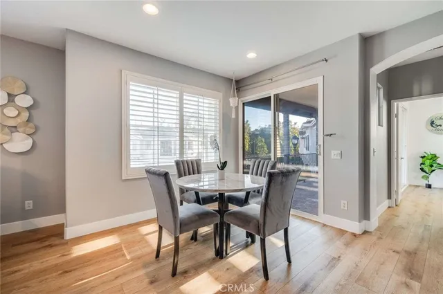 a dining room with furniture window wooden floor