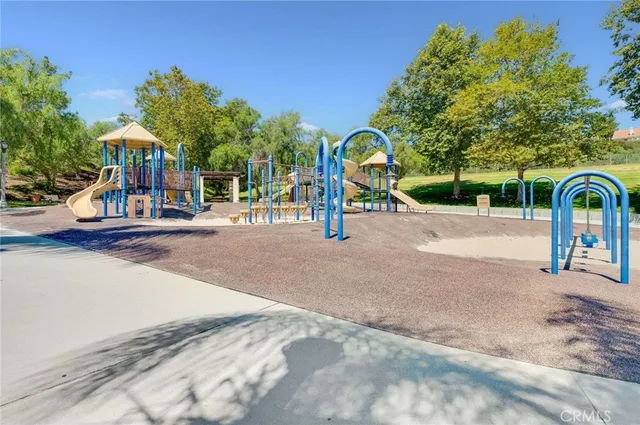 a view of a swimming pool with an outdoor seating and a yard