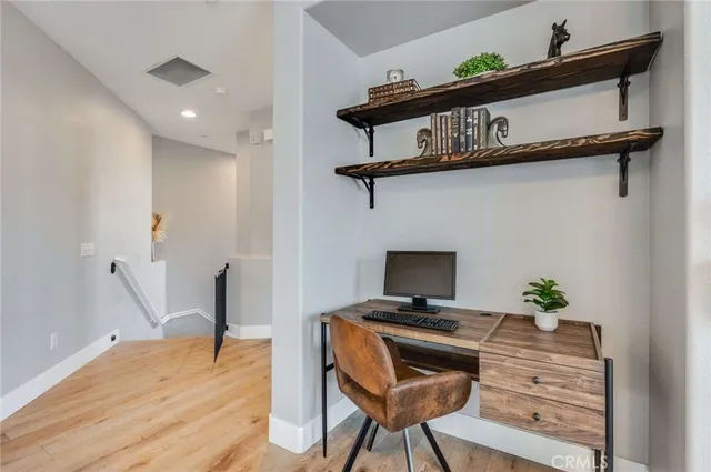 a view of a workspace with furniture