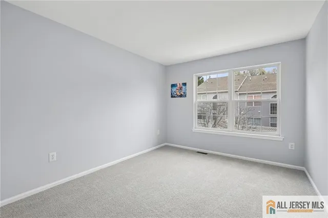 a view of an empty room and closet