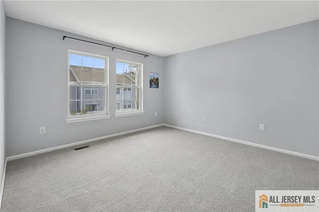 a view of an empty room and entryway