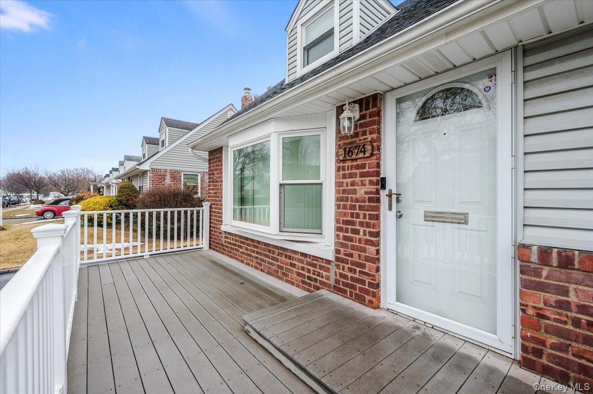 1674 Kroll Road East Meadow, NY 11554 - Photo 2 of 25 a view of a balcony with a barbeque