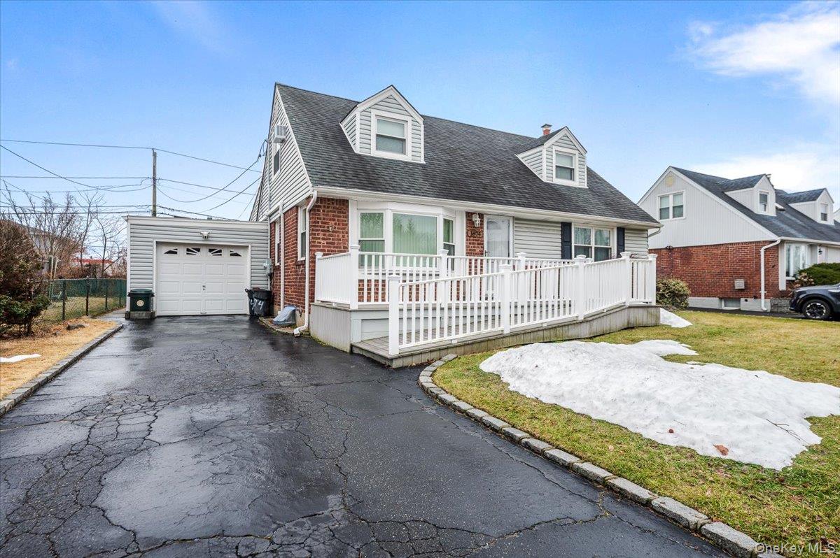 1674 Kroll Road East Meadow, NY 11554 - Photo 25 of 25 a view of a house with a small yard and wooden fence