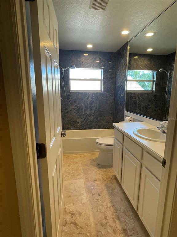 759 Fordingbridge Way Osprey, FL 34229 - Photo 5 of 51 a bathroom with a sink a bathtub a toilet and a shower