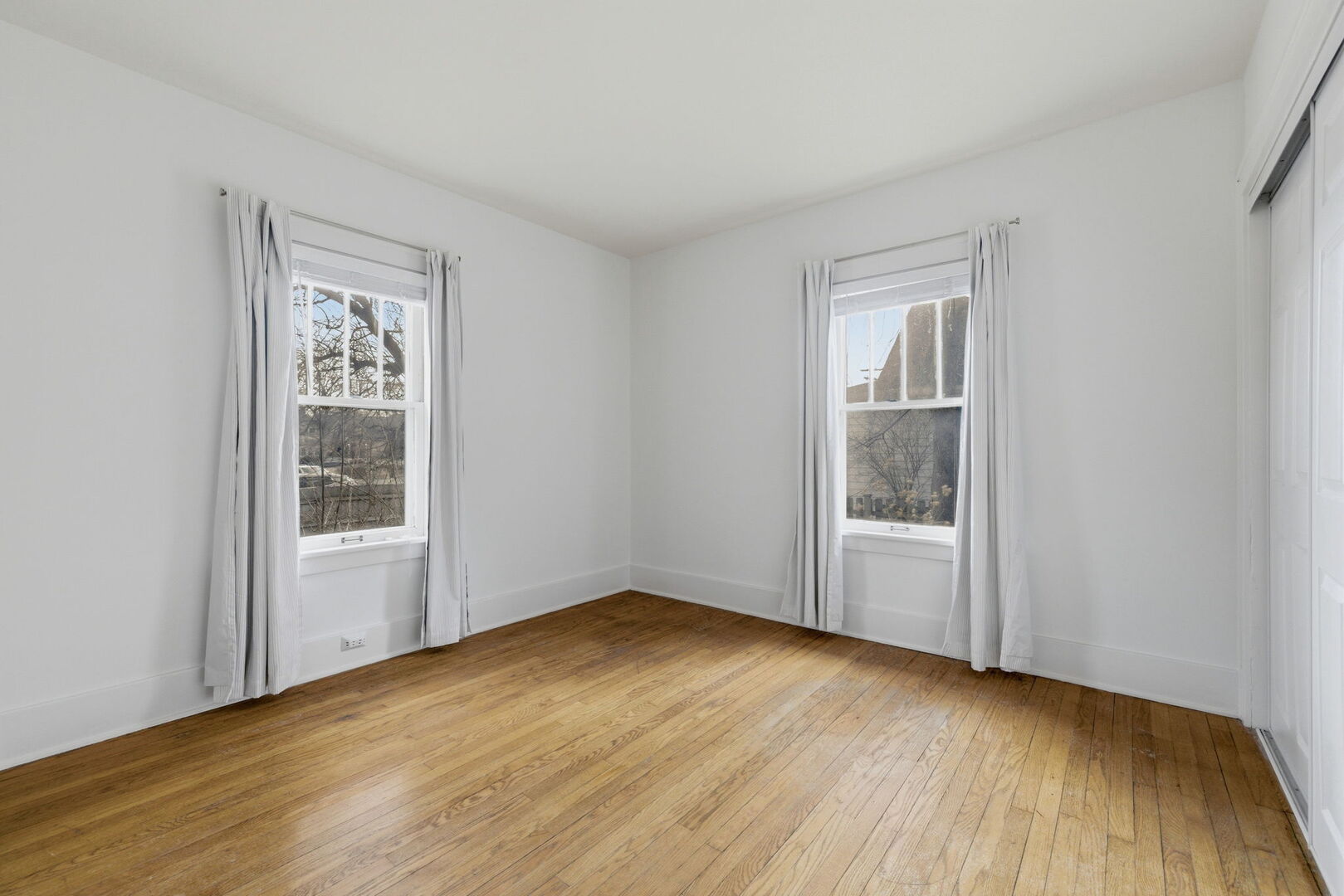 111 Oak Street Frankfort, IL 60423 - Photo 13 of 36 a view of an empty room with wooden floor and a window
