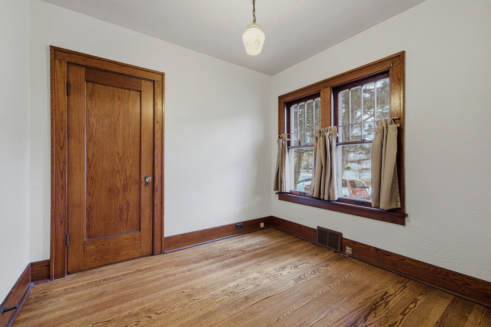 111 Oak Street Frankfort, IL 60423 - Photo 16 of 36 an empty room with wooden floor and windows