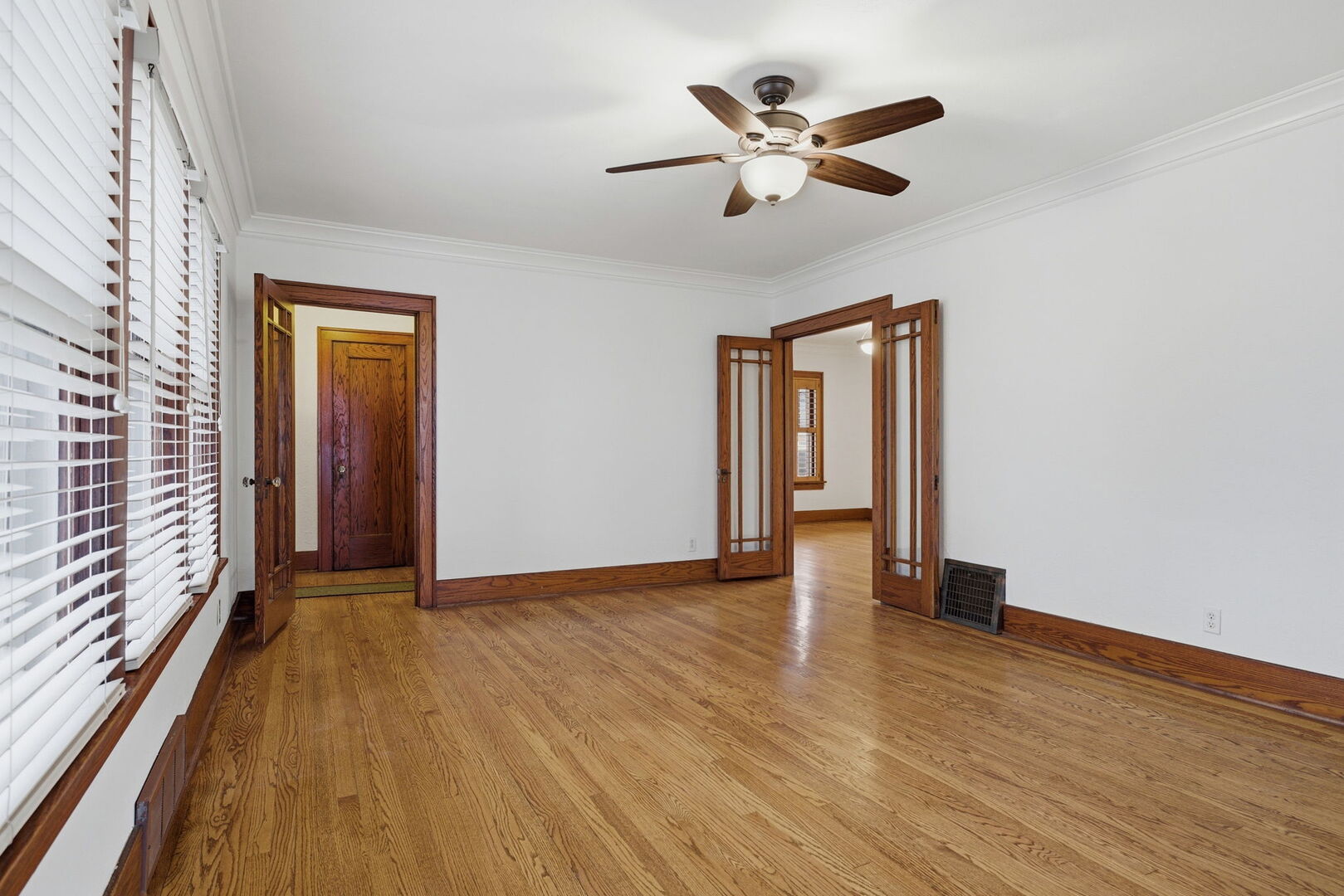 111 Oak Street Frankfort, IL 60423 - Photo 6 of 36 a view of an empty room with wooden floor and a window