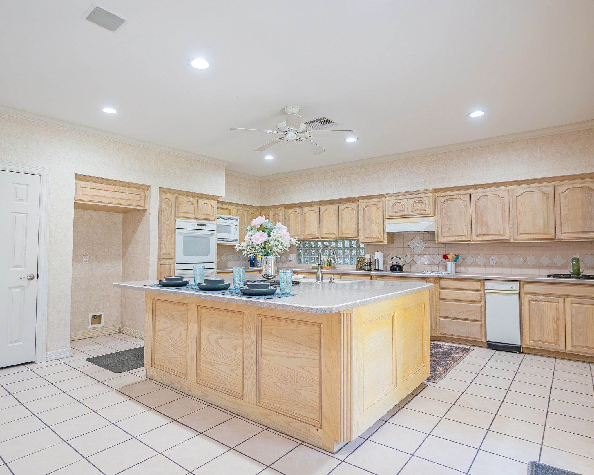 214 Williams Road Bay City, TX 77414 - Photo 29 of 48 a kitchen with cabinets and chairs