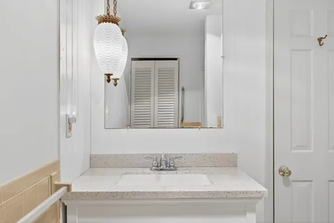 a bathroom with a bathtub and a window