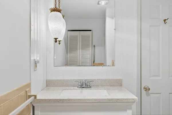 a bathroom with a bathtub and a window