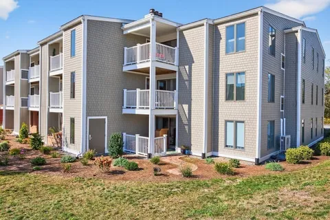 a front view of a house with yard