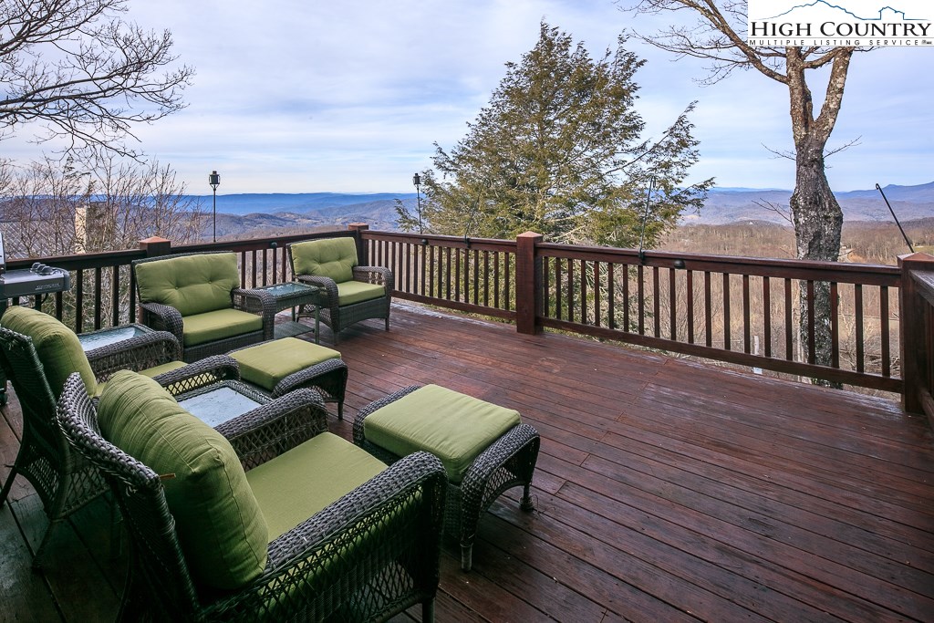 204 Pinnacle Ridge Road Beech Mountain, NC 28604 - Photo 11 of 50 a balcony with furniture and wooden floor