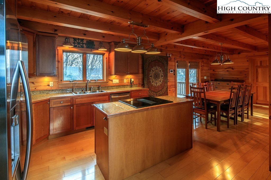 204 Pinnacle Ridge Road Beech Mountain, NC 28604 - Photo 16 of 50 a view of kitchen with sink and chairs
