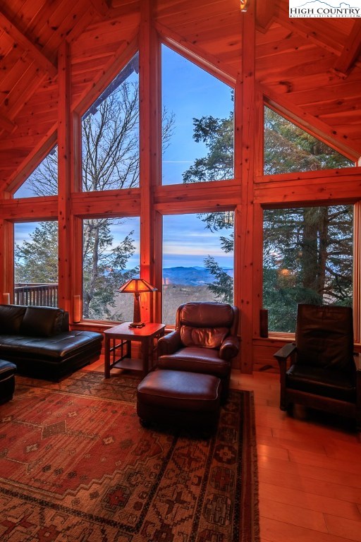 204 Pinnacle Ridge Road Beech Mountain, NC 28604 - Photo 2 of 50 a living room with large windows and a table
