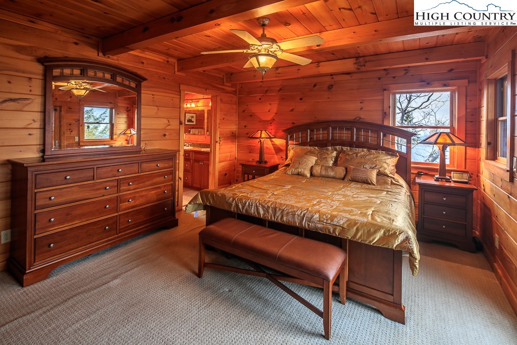 204 Pinnacle Ridge Road Beech Mountain, NC 28604 - Photo 24 of 50 a bed sitting in a room next to a window