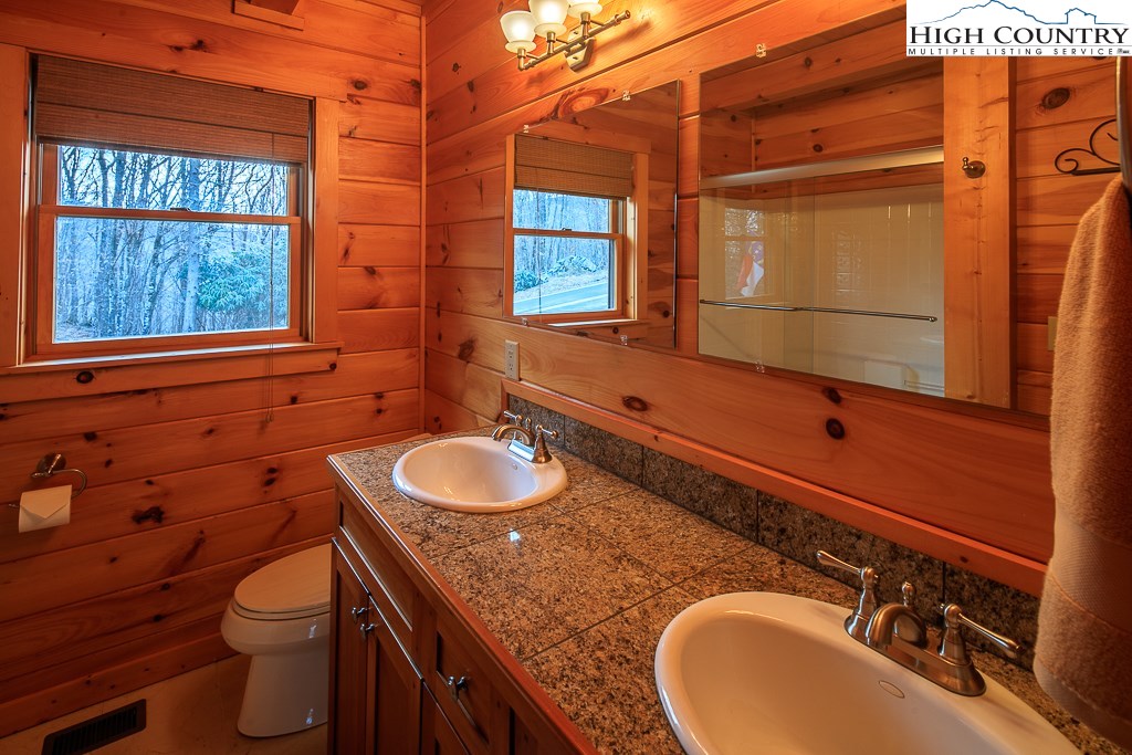 204 Pinnacle Ridge Road Beech Mountain, NC 28604 - Photo 28 of 50 a bathroom with a sink and a mirror