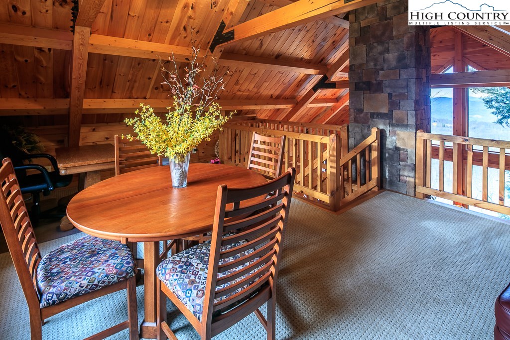 204 Pinnacle Ridge Road Beech Mountain, NC 28604 - Photo 33 of 50 a view of a chairs and table in the patio