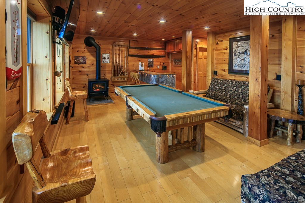 204 Pinnacle Ridge Road Beech Mountain, NC 28604 - Photo 35 of 50 a room with lots of furniture and mirrors