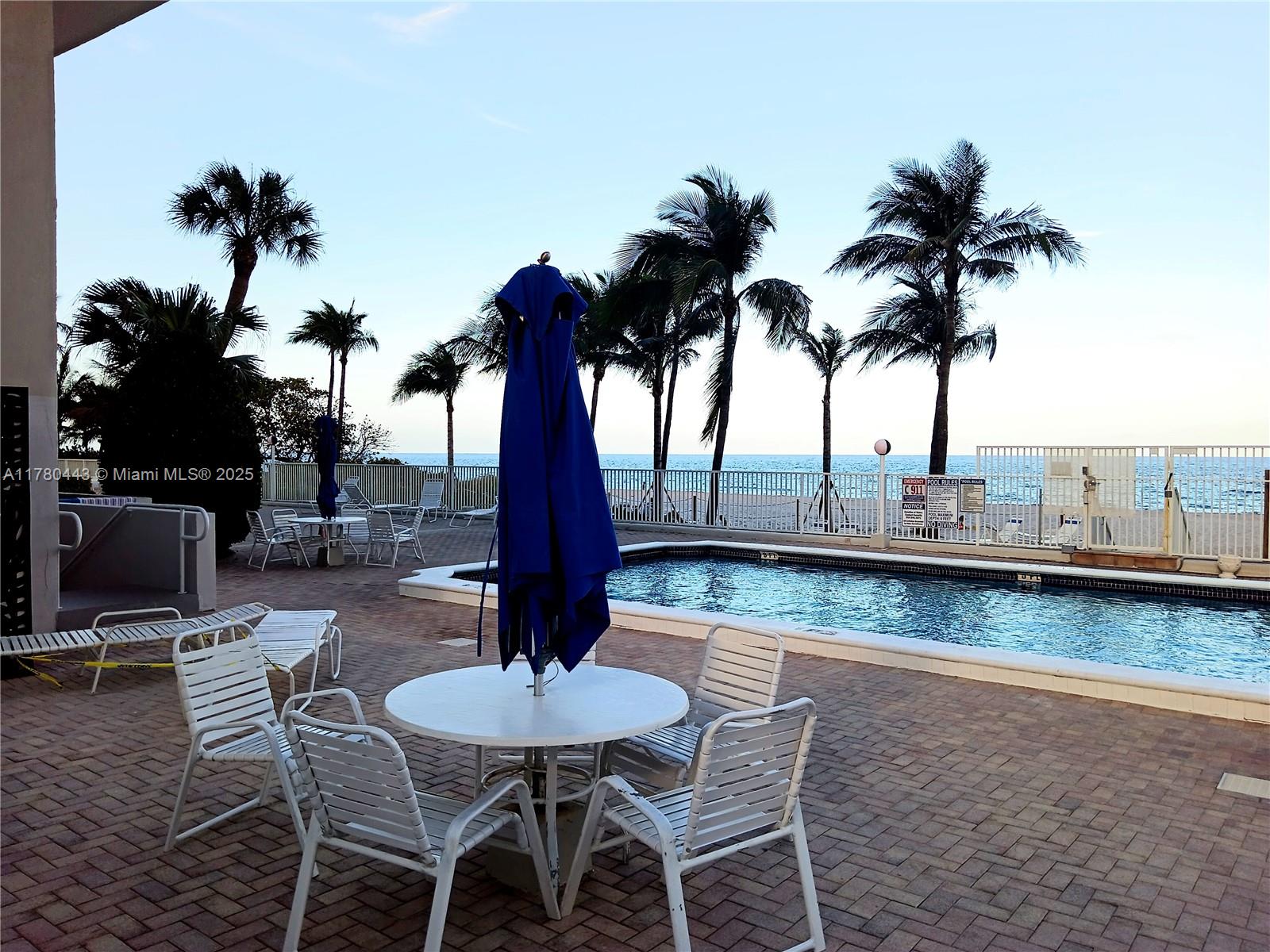 1000 South Ocean Boulevard, Unit 10E Pompano Beach, FL 33062 - Photo 2 of 64 a view of a lake with a table and chairs